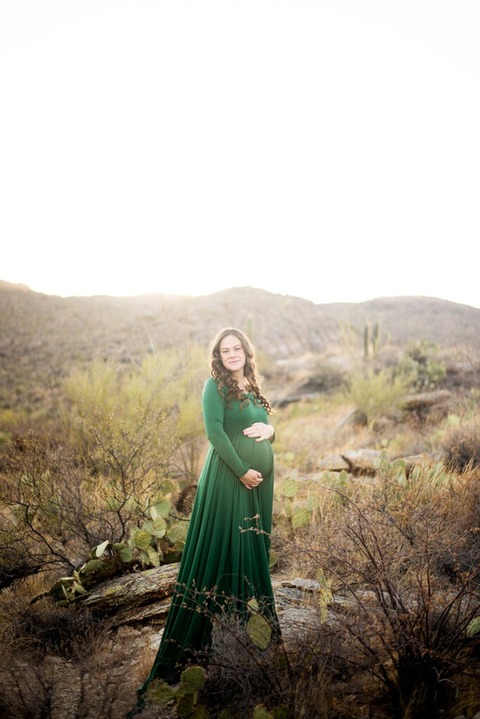 pregnant-woman-wearing-green-dress-in-the-desert