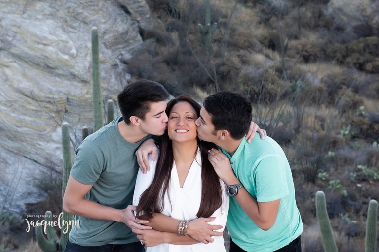 sons kissing their mother's cheek