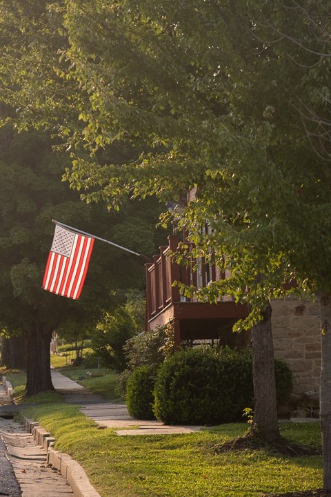 hermann missouri porch with American flag flying