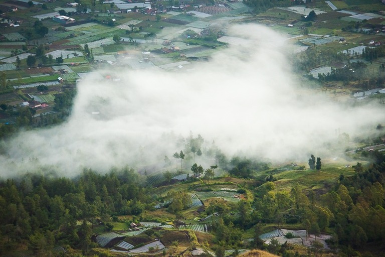 mist and clouds in the valley below right after sunrise Bali Indonesia 